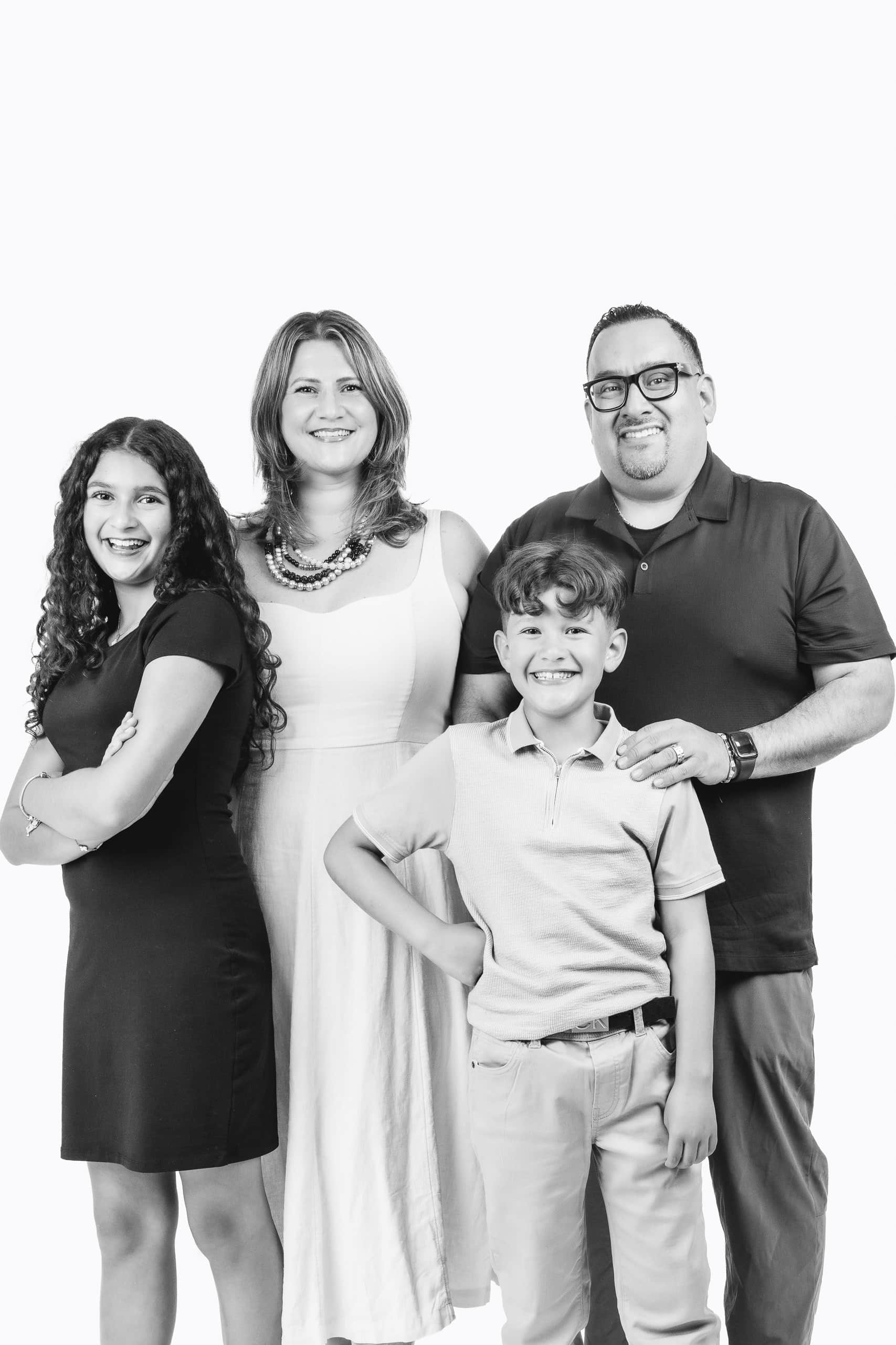 Family portrait at a luxury Portrait Station creating timeless black-and-white keepsakes for weddings and special celebrations.