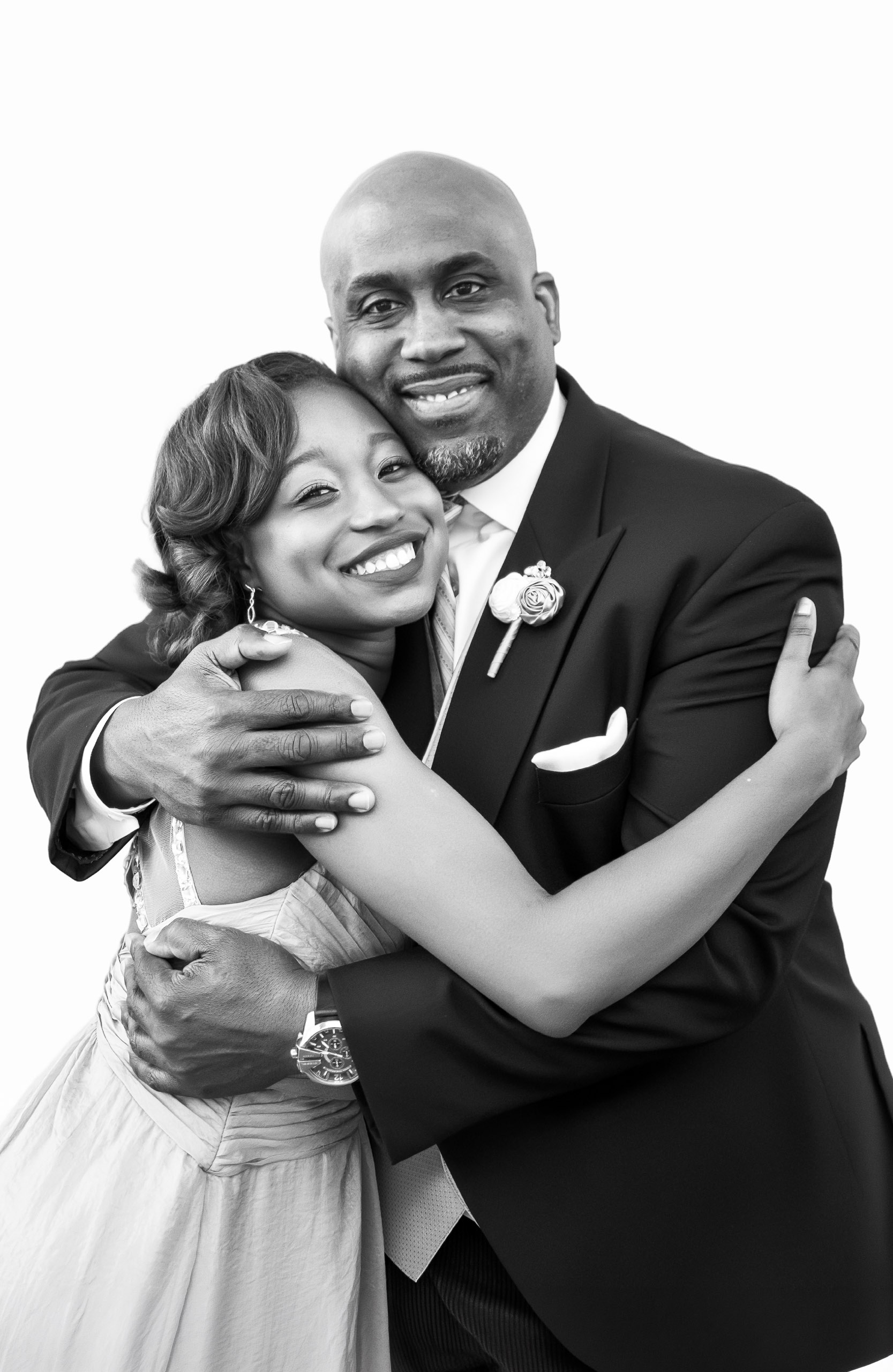 Couple posing for a professional black-and-white portrait at the CLASSIC Portrait Station during a wedding reception.