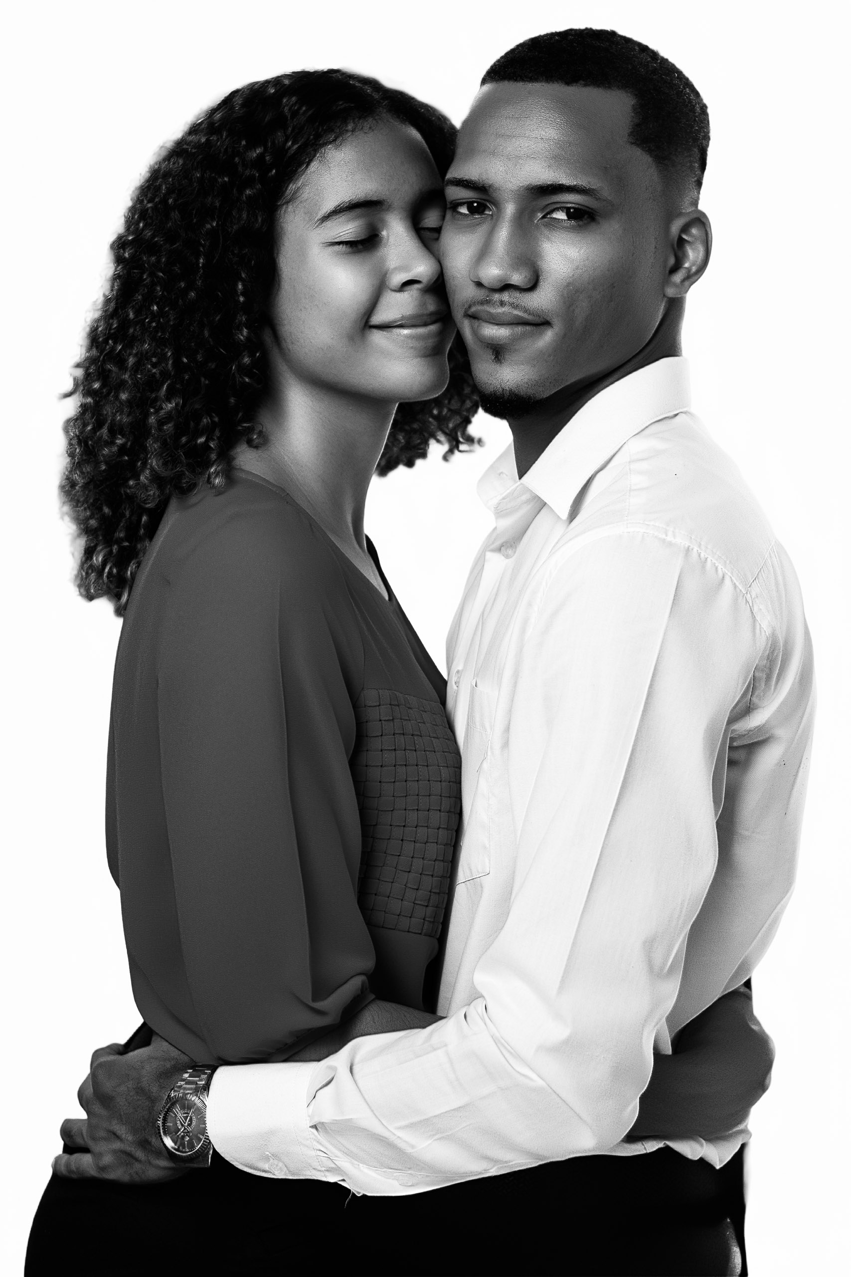 Couple posing at a luxury Portrait Station creating timeless black-and-white portraits for weddings and special events.