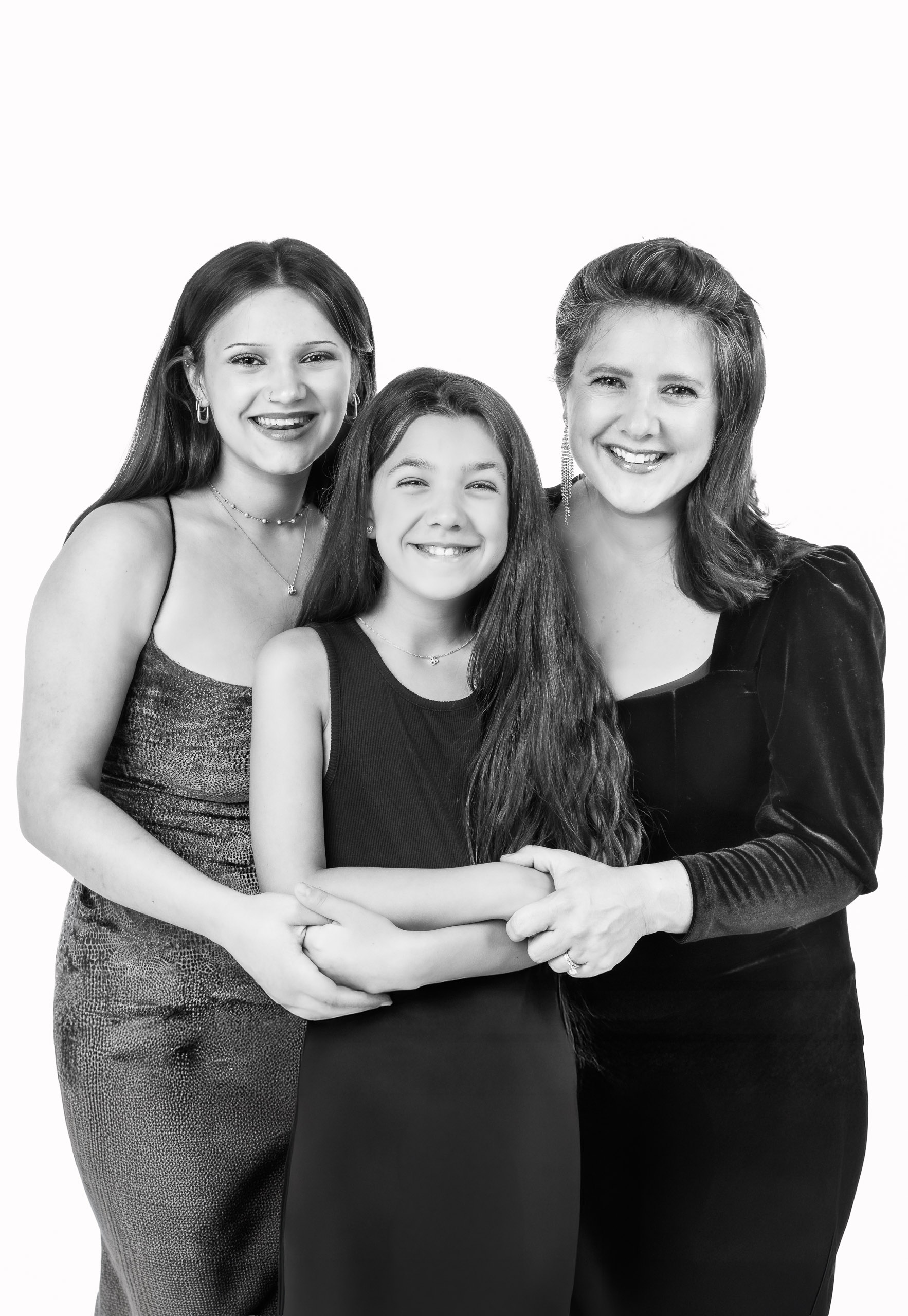 Mother and daughters sharing a timeless portrait at the CLASSIC Portrait Station.