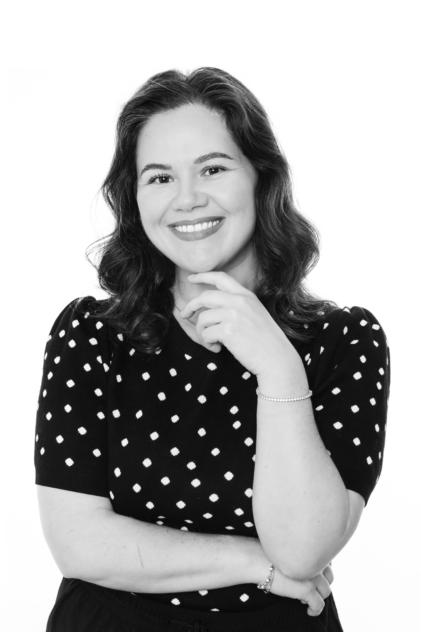 Professional black-and-white portrait of a woman creating a timeless keepsake at the CLASSIC Portrait Station.